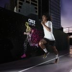 Nike Run Club Coach Rio dela Cruz outpacing his avatar at the Unlimited Stadium