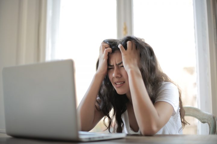 woman stressing over work while at home